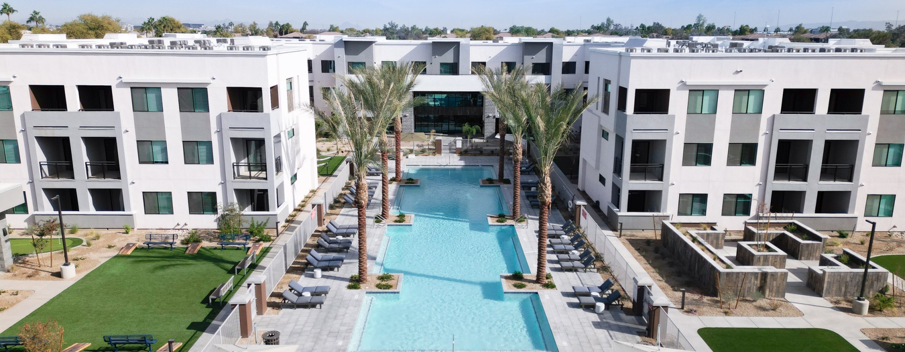 aerial view of a swimming pool with a courtyard
