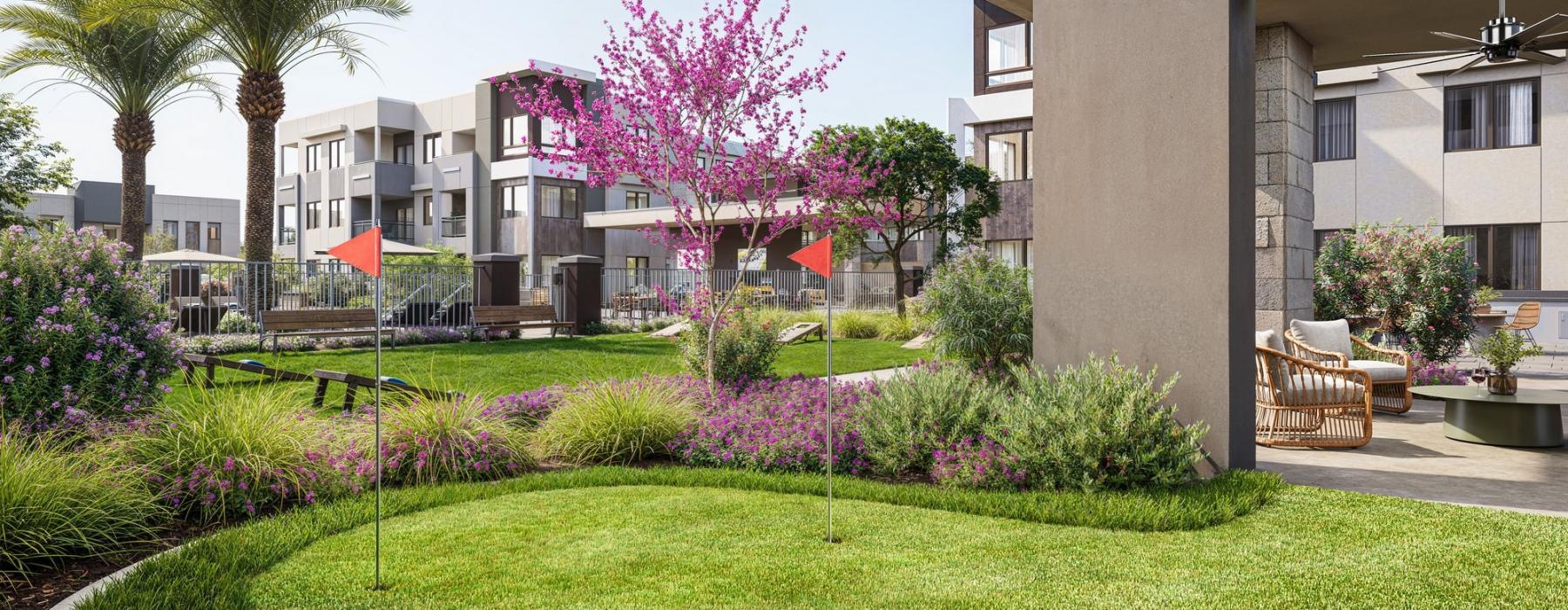 a building with a lawn and trees